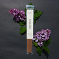 Requiem Incense Company Big Lonely Doug Small Batch Incense - Packaged incense sticks with purple flowers on a dark background